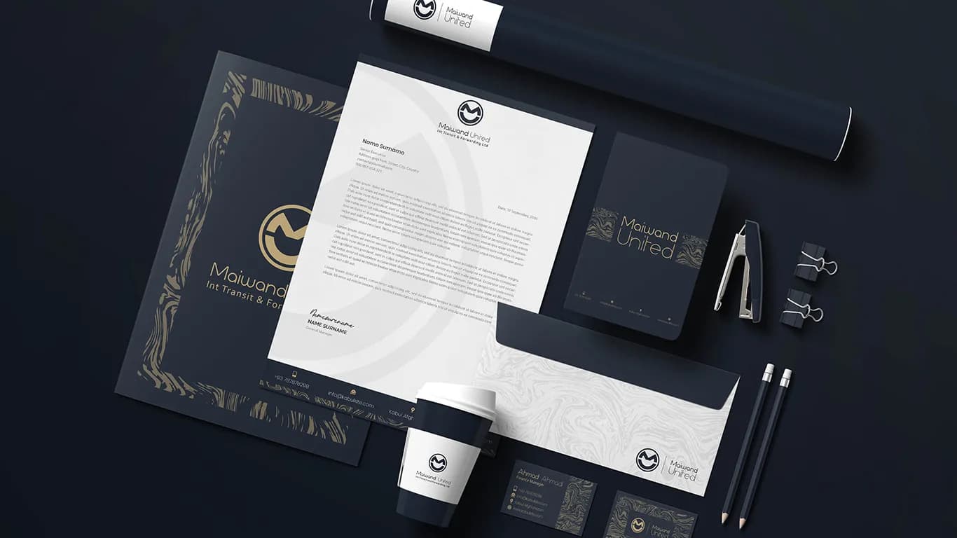 Corporate stationery suite in deep navy: letterhead, business cards and document tube.